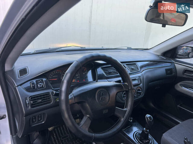 Серый Мицубиси Лансер, объемом двигателя 1.6 л и пробегом 320 тыс. км за 3650 $, фото 28 на Automoto.ua