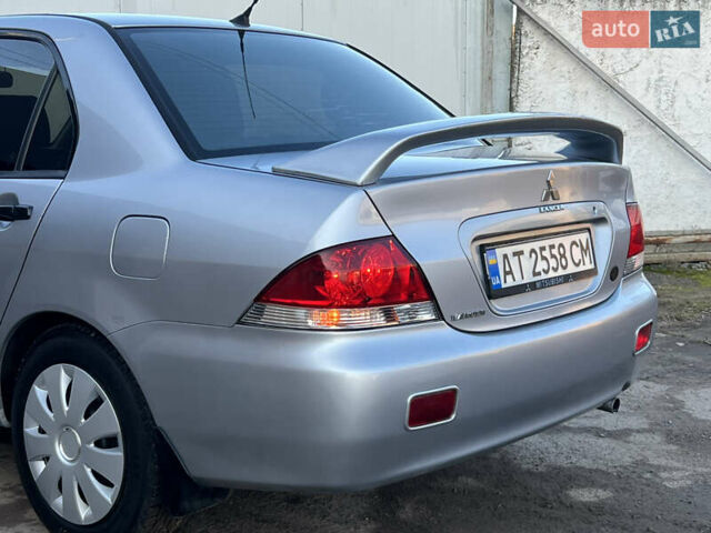 Серый Мицубиси Лансер, объемом двигателя 1.6 л и пробегом 320 тыс. км за 3650 $, фото 19 на Automoto.ua