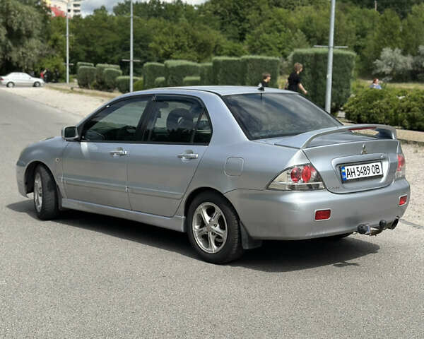 Сірий Міцубісі Lancer, об'ємом двигуна 2 л та пробігом 200 тис. км за 3550 $, фото 2 на Automoto.ua