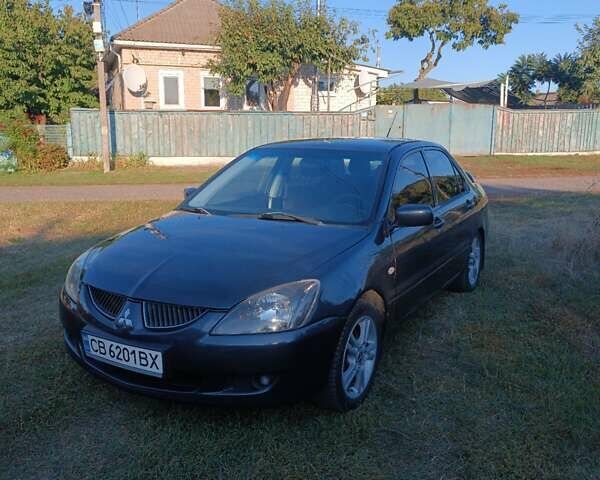 Мицубиси Лансер 2004 в Нежине на Automoto.ua Серый Мицубиси Лансер, объемом двигателя 2 л и пробегом 280 тыс. км за 6000 $, фото 6 на Automoto.ua