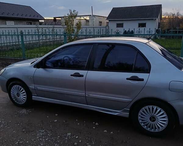 Мицубиси Лансер 2004 в Черновцах на Automoto.ua Серый Мицубиси Лансер, объемом двигателя 1.58 л и пробегом 439 тыс. км за 2750 $, фото 21 на Automoto.ua