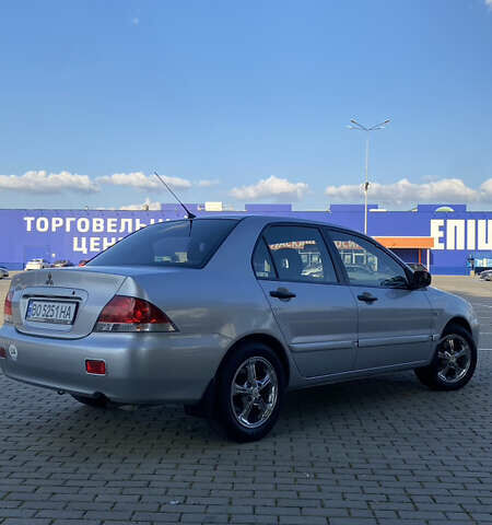 Сірий Міцубісі Lancer, об'ємом двигуна 1.58 л та пробігом 270 тис. км за 1999 $, фото 6 на Automoto.ua
