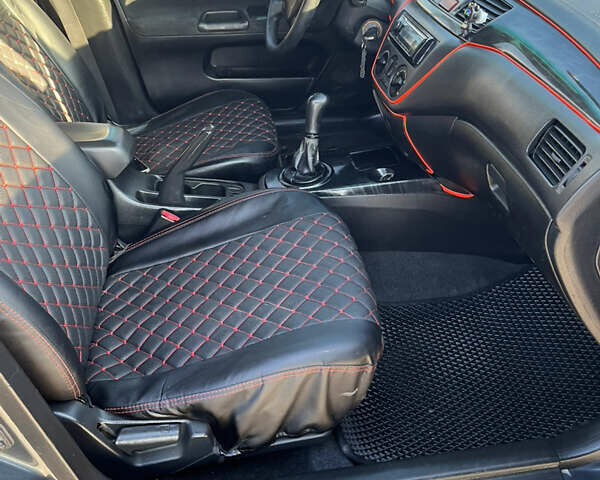 Сірий Міцубісі Lancer, об'ємом двигуна 1.58 л та пробігом 300 тис. км за 3800 $, фото 20 на Automoto.ua