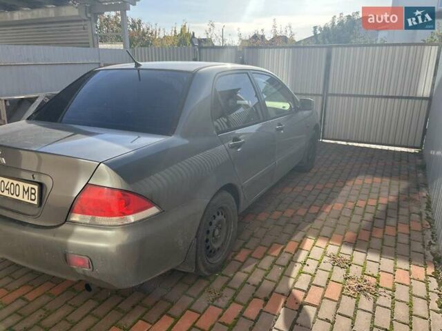 Сірий Міцубісі Lancer, об'ємом двигуна 1.58 л та пробігом 262 тис. км за 3900 $, фото 2 на Automoto.ua