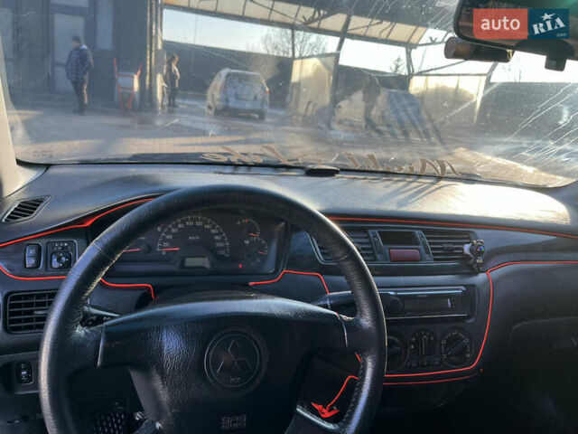 Сірий Міцубісі Lancer, об'ємом двигуна 1.58 л та пробігом 300 тис. км за 3800 $, фото 21 на Automoto.ua