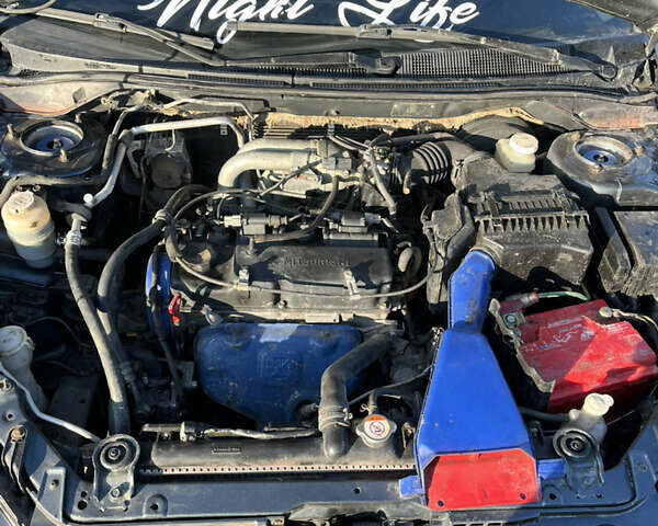 Сірий Міцубісі Lancer, об'ємом двигуна 1.58 л та пробігом 300 тис. км за 3800 $, фото 23 на Automoto.ua