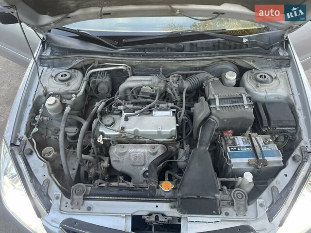 Сірий Міцубісі Lancer, об'ємом двигуна 1.58 л та пробігом 271 тис. км за 3000 $, фото 28 на Automoto.ua