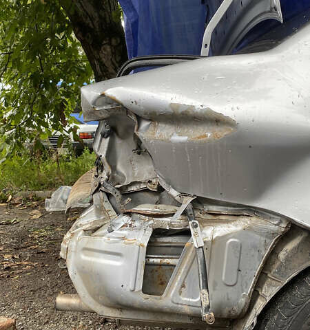 Сірий Міцубісі Lancer, об'ємом двигуна 1.58 л та пробігом 270 тис. км за 1999 $, фото 17 на Automoto.ua
