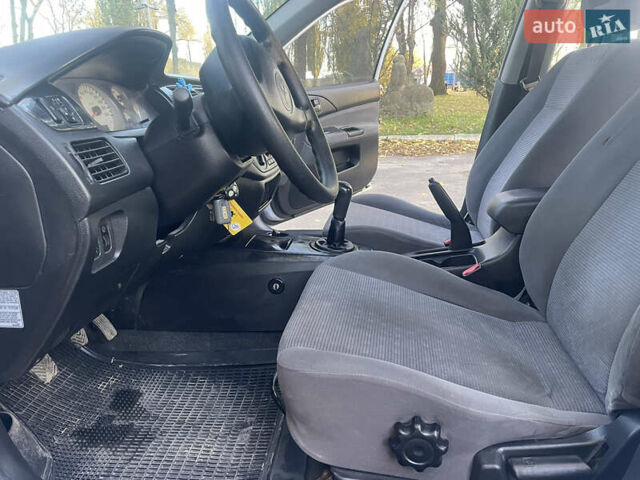 Сірий Міцубісі Lancer, об'ємом двигуна 1.58 л та пробігом 271 тис. км за 3000 $, фото 20 на Automoto.ua