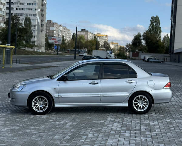 Сірий Міцубісі Lancer, об'ємом двигуна 1.6 л та пробігом 260 тис. км за 3899 $, фото 1 на Automoto.ua