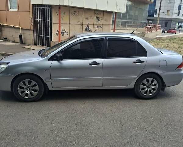 Сірий Міцубісі Lancer, об'ємом двигуна 1.58 л та пробігом 222 тис. км за 4000 $, фото 2 на Automoto.ua