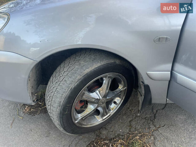 Сірий Міцубісі Lancer, об'ємом двигуна 1.58 л та пробігом 271 тис. км за 3000 $, фото 15 на Automoto.ua