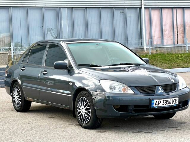 Серый Мицубиси Лансер, объемом двигателя 1.6 л и пробегом 490 тыс. км за 1799 $, фото 1 на Automoto.ua