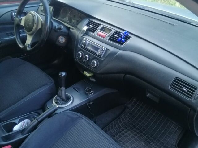 Сірий Міцубісі Lancer, об'ємом двигуна 2 л та пробігом 304 тис. км за 5000 $, фото 5 на Automoto.ua