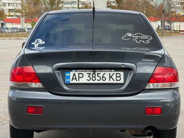 Серый Мицубиси Лансер, объемом двигателя 1.6 л и пробегом 490 тыс. км за 1799 $, фото 3 на Automoto.ua