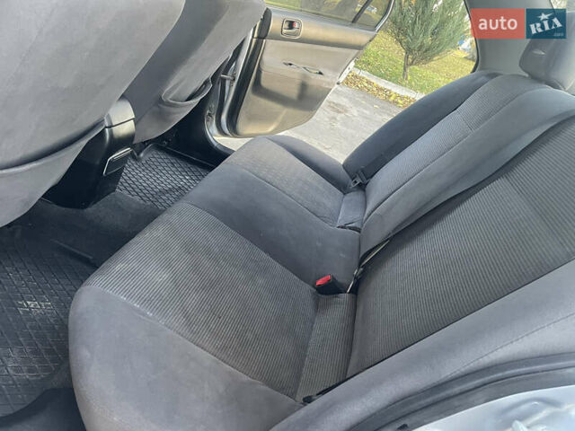 Сірий Міцубісі Lancer, об'ємом двигуна 1.58 л та пробігом 271 тис. км за 3000 $, фото 22 на Automoto.ua