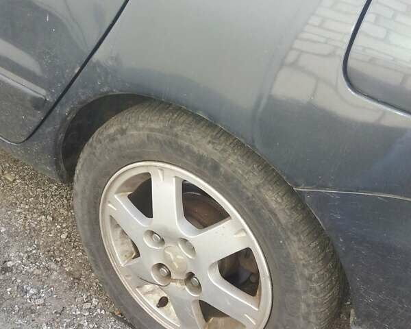 Сірий Міцубісі Lancer, об'ємом двигуна 1.58 л та пробігом 531 тис. км за 2828 $, фото 8 на Automoto.ua