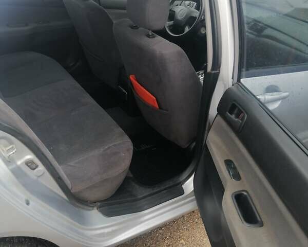 Міцубісі Lancer 2004 у Харкові на Automoto.ua Сірий Міцубісі Lancer, об'ємом двигуна 1.58 л та пробігом 248 тис. км за 3550 $, фото 6 на Automoto.ua