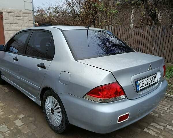 Сірий Міцубісі Lancer, об'ємом двигуна 1.58 л та пробігом 439 тис. км за 2500 $, фото 4 на Automoto.ua