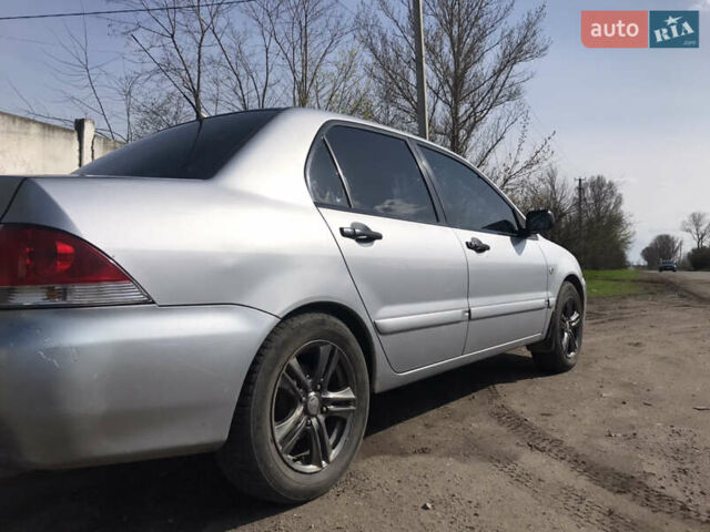 Мицубиси Лансер 2004 в Днепре (Днепропетровске) на Automoto.ua Серый Мицубиси Лансер, объемом двигателя 1.59 л и пробегом 294 тыс. км за 4699 $, фото 4 на Automoto.ua