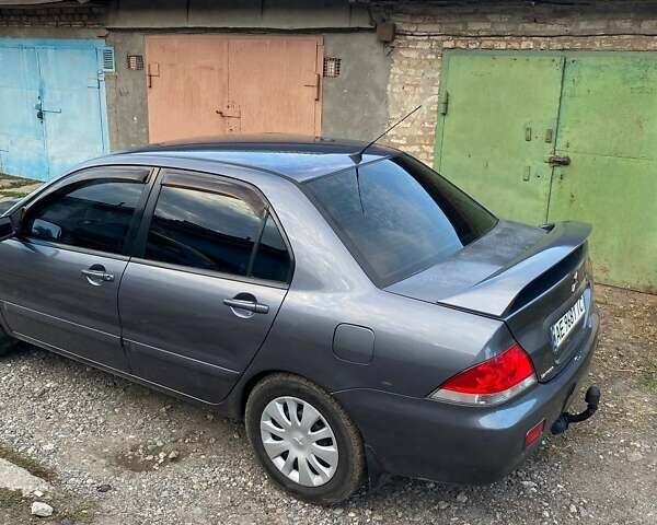 Сірий Міцубісі Lancer, об'ємом двигуна 1.58 л та пробігом 307 тис. км за 3800 $, фото 3 на Automoto.ua