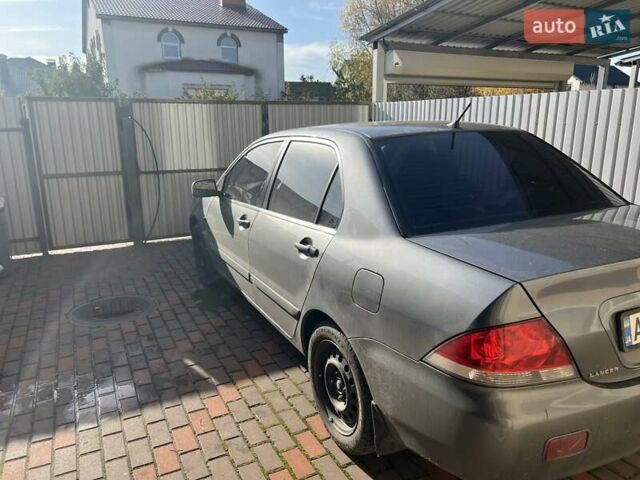 Сірий Міцубісі Lancer, об'ємом двигуна 1.58 л та пробігом 262 тис. км за 3900 $, фото 3 на Automoto.ua