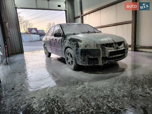 Сірий Міцубісі Lancer, об'ємом двигуна 1.58 л та пробігом 300 тис. км за 4200 $, фото 12 на Automoto.ua