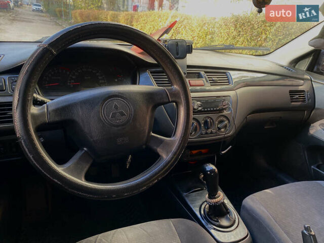 Сірий Міцубісі Lancer, об'ємом двигуна 1.3 л та пробігом 376 тис. км за 3700 $, фото 8 на Automoto.ua