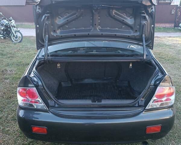 Мицубиси Лансер 2004 в Нежине на Automoto.ua Серый Мицубиси Лансер, объемом двигателя 2 л и пробегом 280 тыс. км за 6000 $, фото 14 на Automoto.ua