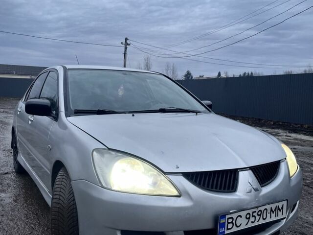 Серый Мицубиси Лансер, объемом двигателя 1.6 л и пробегом 315 тыс. км за 2950 $, фото 1 на Automoto.ua