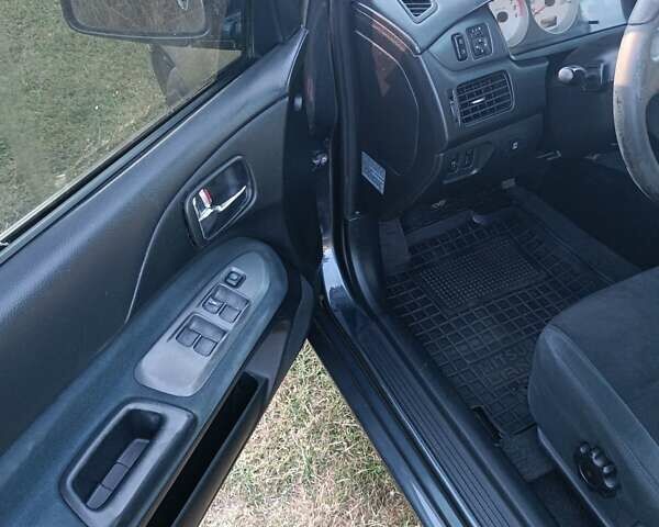 Мицубиси Лансер 2004 в Нежине на Automoto.ua Серый Мицубиси Лансер, объемом двигателя 2 л и пробегом 280 тыс. км за 6000 $, фото 3 на Automoto.ua