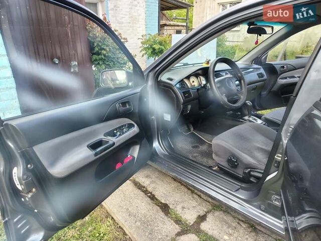 Сірий Міцубісі Lancer, об'ємом двигуна 1.58 л та пробігом 300 тис. км за 4200 $, фото 4 на Automoto.ua