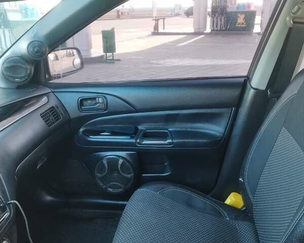 Сірий Міцубісі Lancer, об'ємом двигуна 1.58 л та пробігом 360 тис. км за 4000 $, фото 12 на Automoto.ua