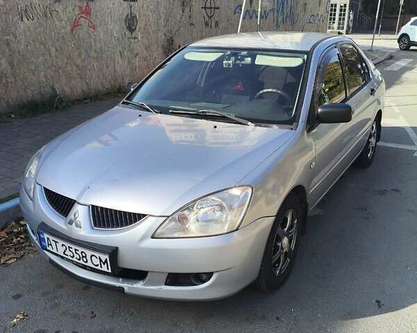 Сірий Міцубісі Lancer, об'ємом двигуна 1.58 л та пробігом 320 тис. км за 3700 $, фото 4 на Automoto.ua