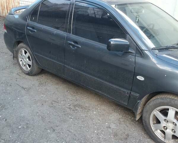 Сірий Міцубісі Lancer, об'ємом двигуна 1.58 л та пробігом 531 тис. км за 2828 $, фото 2 на Automoto.ua