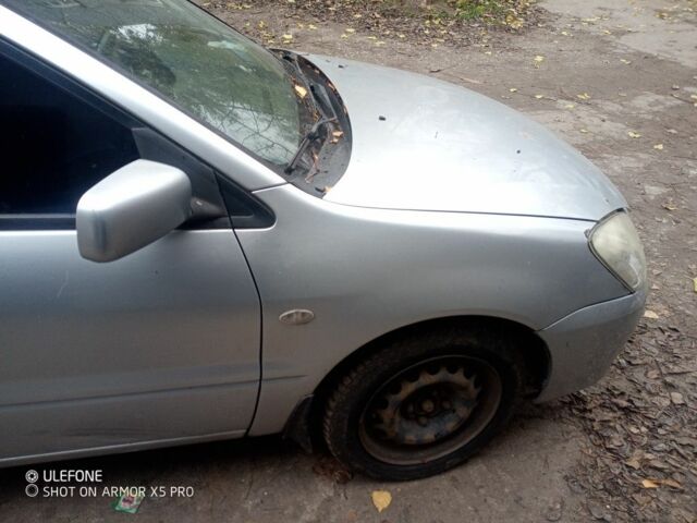 Серый Мицубиси Лансер, объемом двигателя 1.6 л и пробегом 320 тыс. км за 2851 $, фото 3 на Automoto.ua