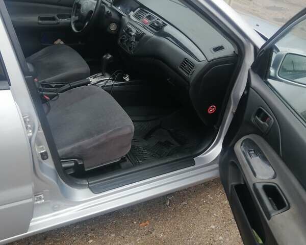 Міцубісі Lancer 2004 у Харкові на Automoto.ua Сірий Міцубісі Lancer, об'ємом двигуна 1.58 л та пробігом 248 тис. км за 3550 $, фото 7 на Automoto.ua