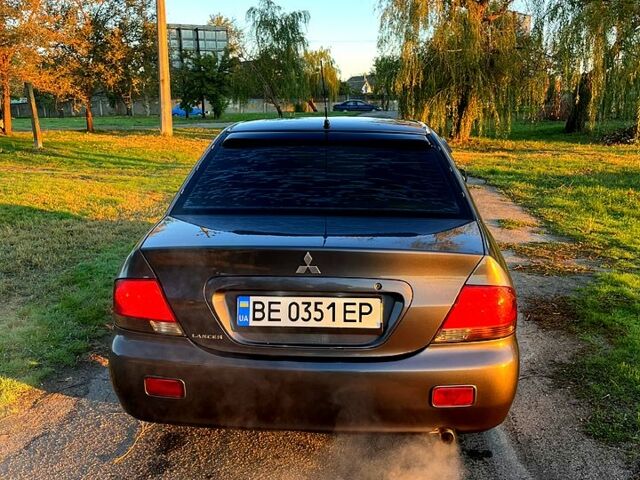 Серый Мицубиси Лансер, объемом двигателя 1.6 л и пробегом 275 тыс. км за 3000 $, фото 5 на Automoto.ua