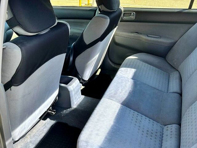 Серый Мицубиси Лансер, объемом двигателя 1.3 л и пробегом 245 тыс. км за 3000 $, фото 10 на Automoto.ua