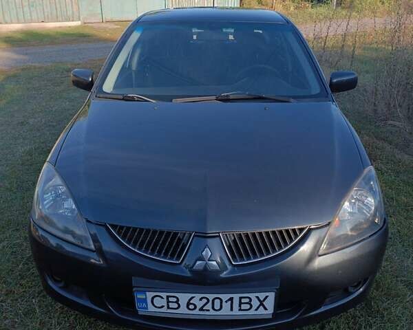 Мицубиси Лансер 2004 в Нежине на Automoto.ua Серый Мицубиси Лансер, объемом двигателя 2 л и пробегом 280 тыс. км за 6000 $, фото 7 на Automoto.ua