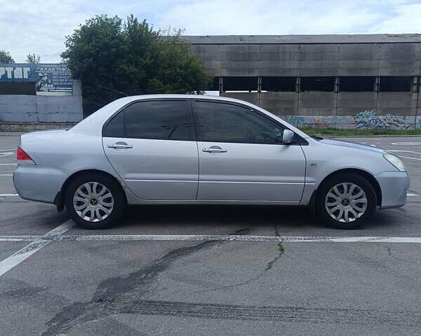 Сірий Міцубісі Lancer, об'ємом двигуна 1.6 л та пробігом 242 тис. км за 4300 $, фото 2 на Automoto.ua
