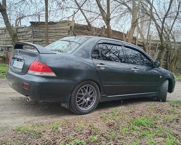 Сірий Міцубісі Lancer, об'ємом двигуна 1.58 л та пробігом 360 тис. км за 4000 $, фото 6 на Automoto.ua