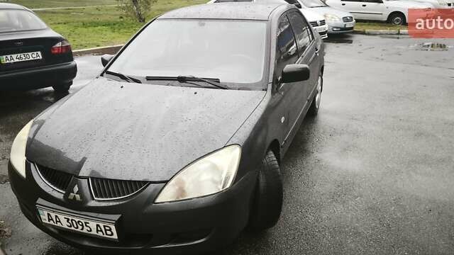 Сірий Міцубісі Lancer, об'ємом двигуна 1.58 л та пробігом 110 тис. км за 2999 $, фото 1 на Automoto.ua