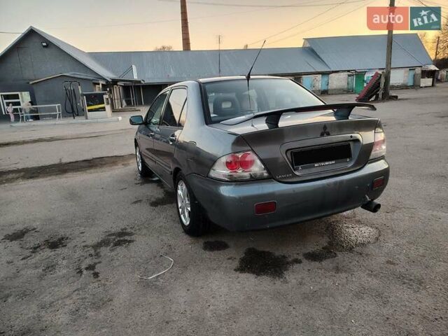 Сірий Міцубісі Lancer, об'ємом двигуна 1.58 л та пробігом 300 тис. км за 4200 $, фото 7 на Automoto.ua