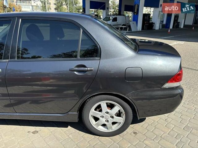 Сірий Міцубісі Lancer, об'ємом двигуна 1.58 л та пробігом 167 тис. км за 5100 $, фото 7 на Automoto.ua