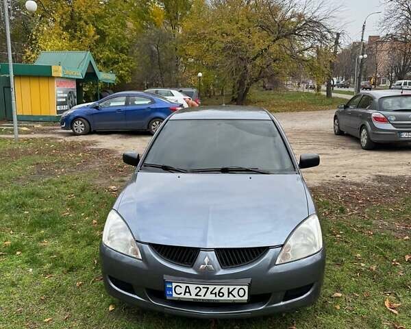 Серый Мицубиси Лансер, объемом двигателя 1.58 л и пробегом 313 тыс. км за 4650 $, фото 4 на Automoto.ua