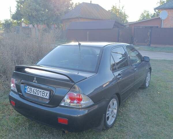 Мицубиси Лансер 2004 в Нежине на Automoto.ua Серый Мицубиси Лансер, объемом двигателя 2 л и пробегом 280 тыс. км за 6000 $, фото 2 на Automoto.ua