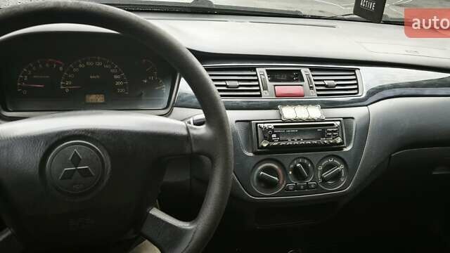 Сірий Міцубісі Lancer, об'ємом двигуна 1.58 л та пробігом 110 тис. км за 2999 $, фото 16 на Automoto.ua