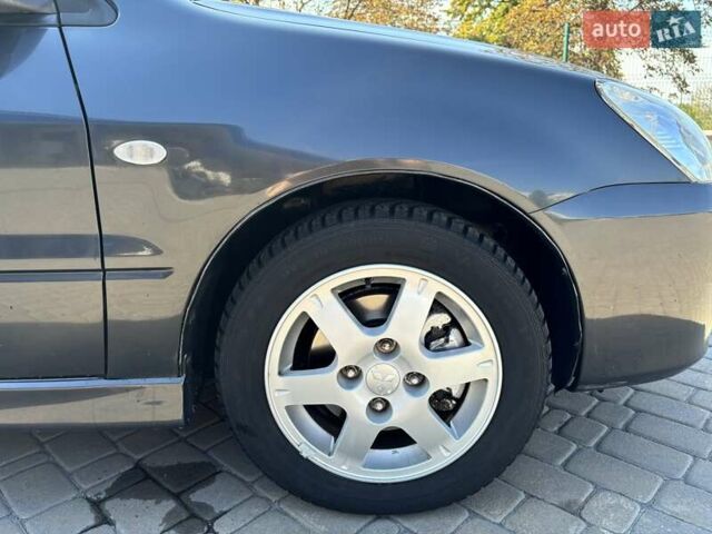 Сірий Міцубісі Lancer, об'ємом двигуна 1.58 л та пробігом 167 тис. км за 5100 $, фото 5 на Automoto.ua
