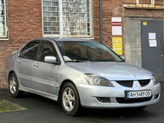 Серый Мицубиси Лансер, объемом двигателя 2 л и пробегом 180 тыс. км за 3700 $, фото 3 на Automoto.ua